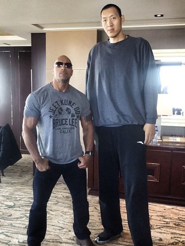 It’s a serious optical illusion to see Rock next to the tallest basketball player ever.